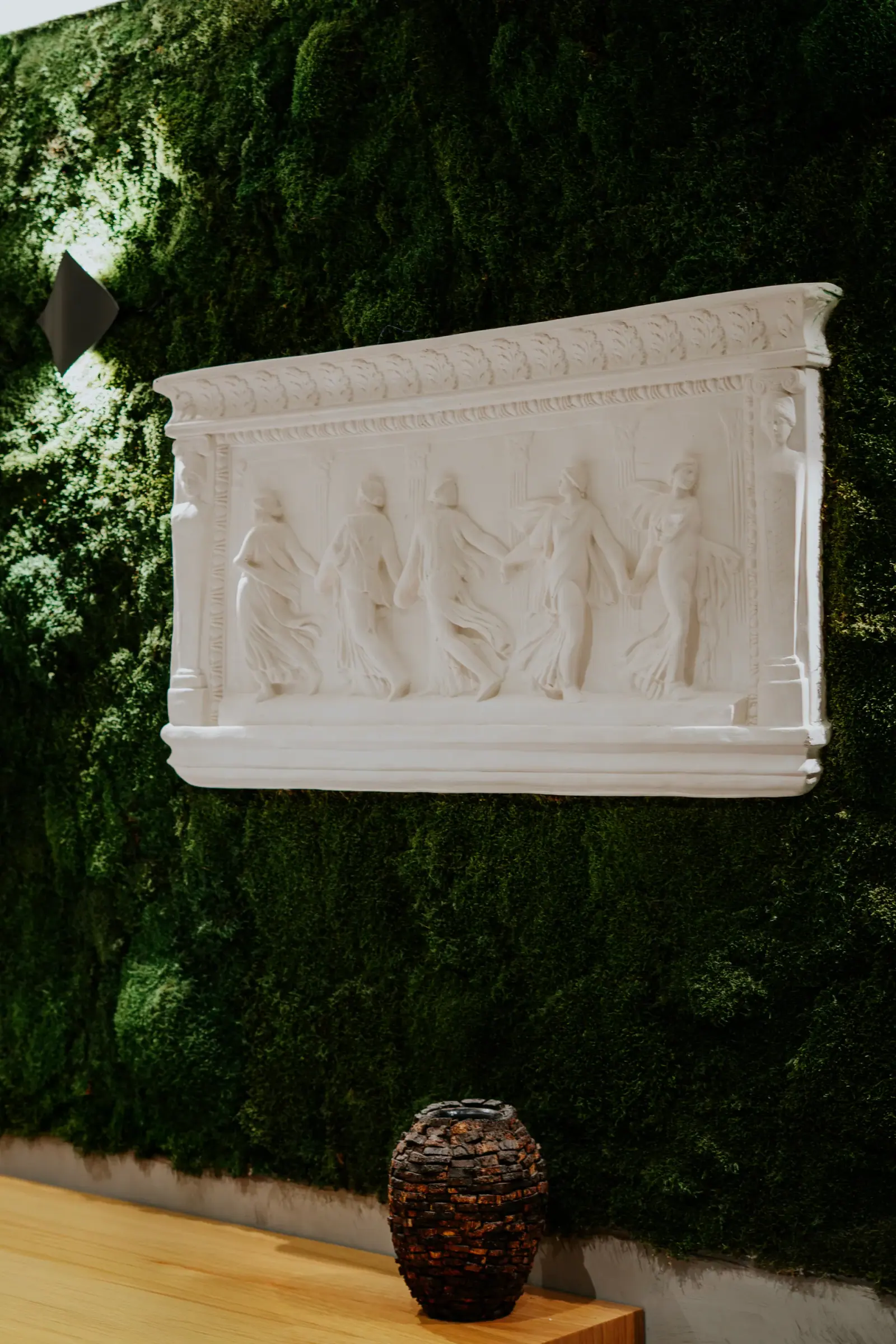 Relief panel in front of a green wall — Tepekent Villa, Büyükçekmece, Istanbul